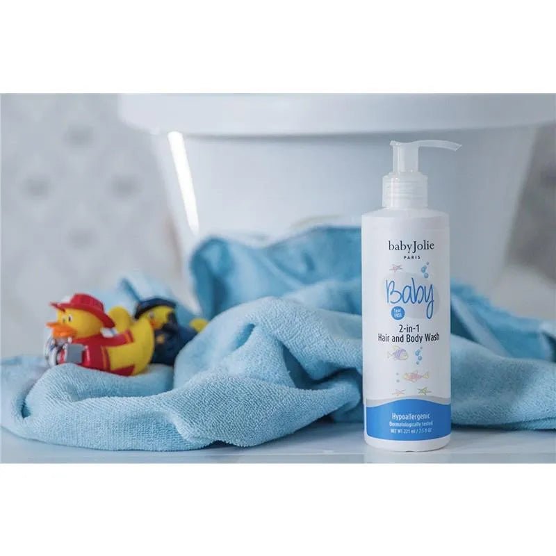 Baby Jolie 2-in-1 hair and body wash pump bottle on a blue towel with rubber duck toys.