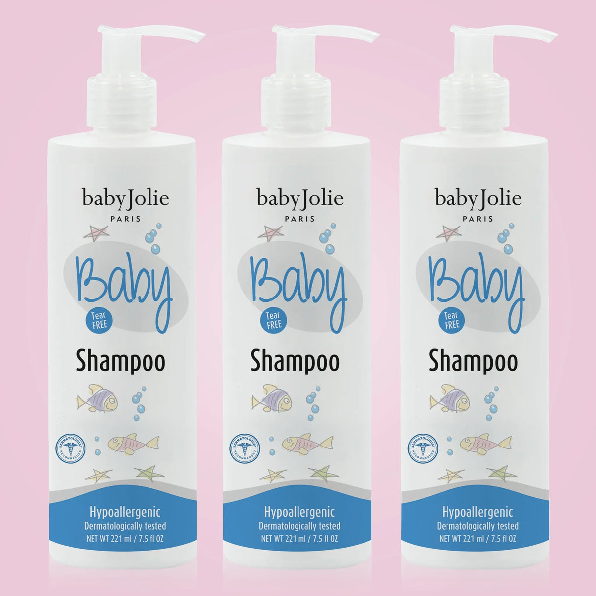 Three white pump bottles of Baby Jolie tear-free shampoo, 7.5oz each, featuring blue fish and star graphics on a pink background.