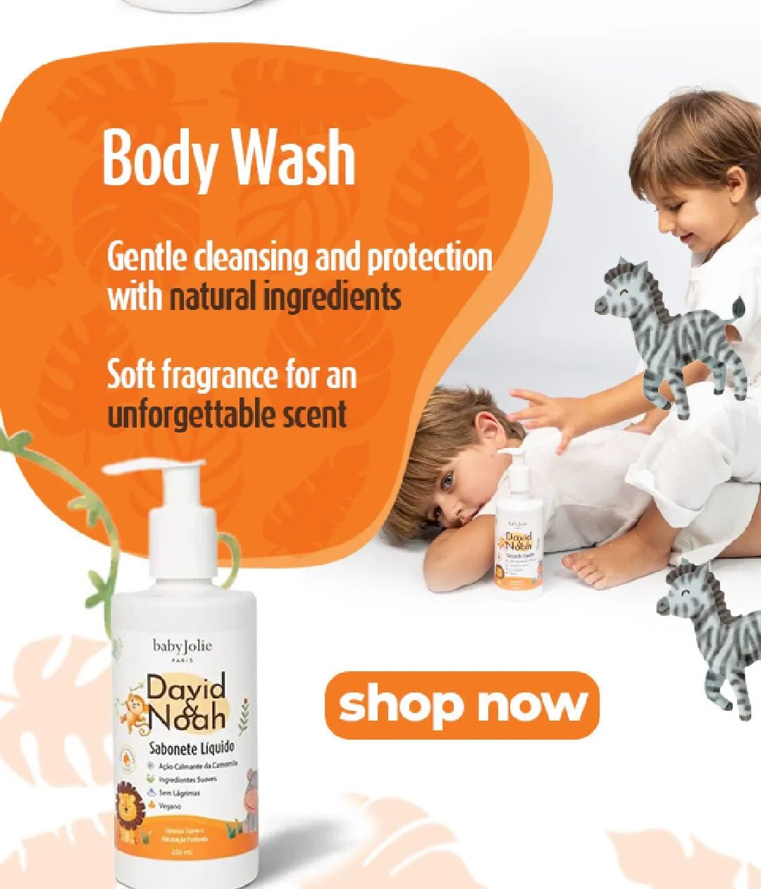David & Noah body wash bottle with pump, featuring a white label with lion illustration, next to two children playing.
