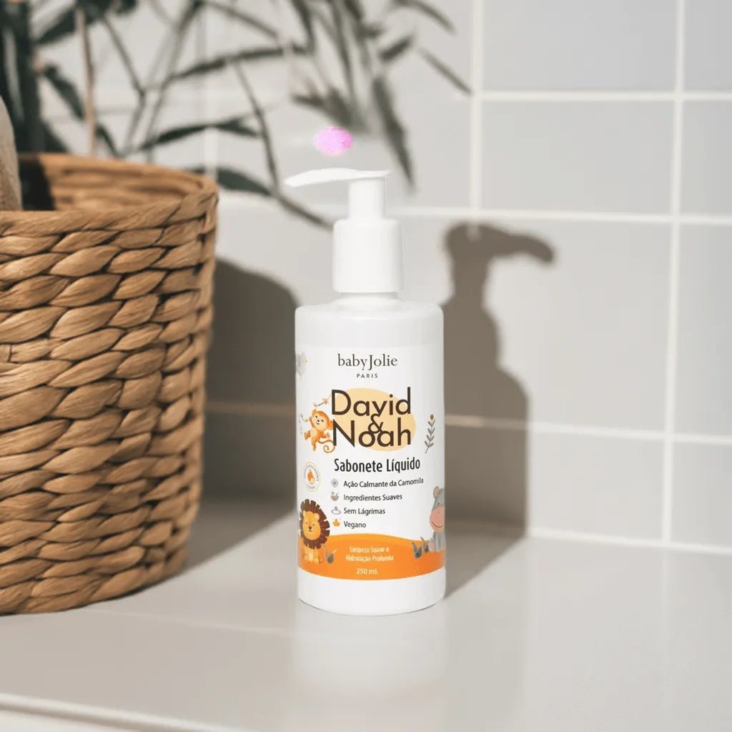 White pump bottle of David & Noah vegan body wash with cute animal illustrations on a bathroom counter.