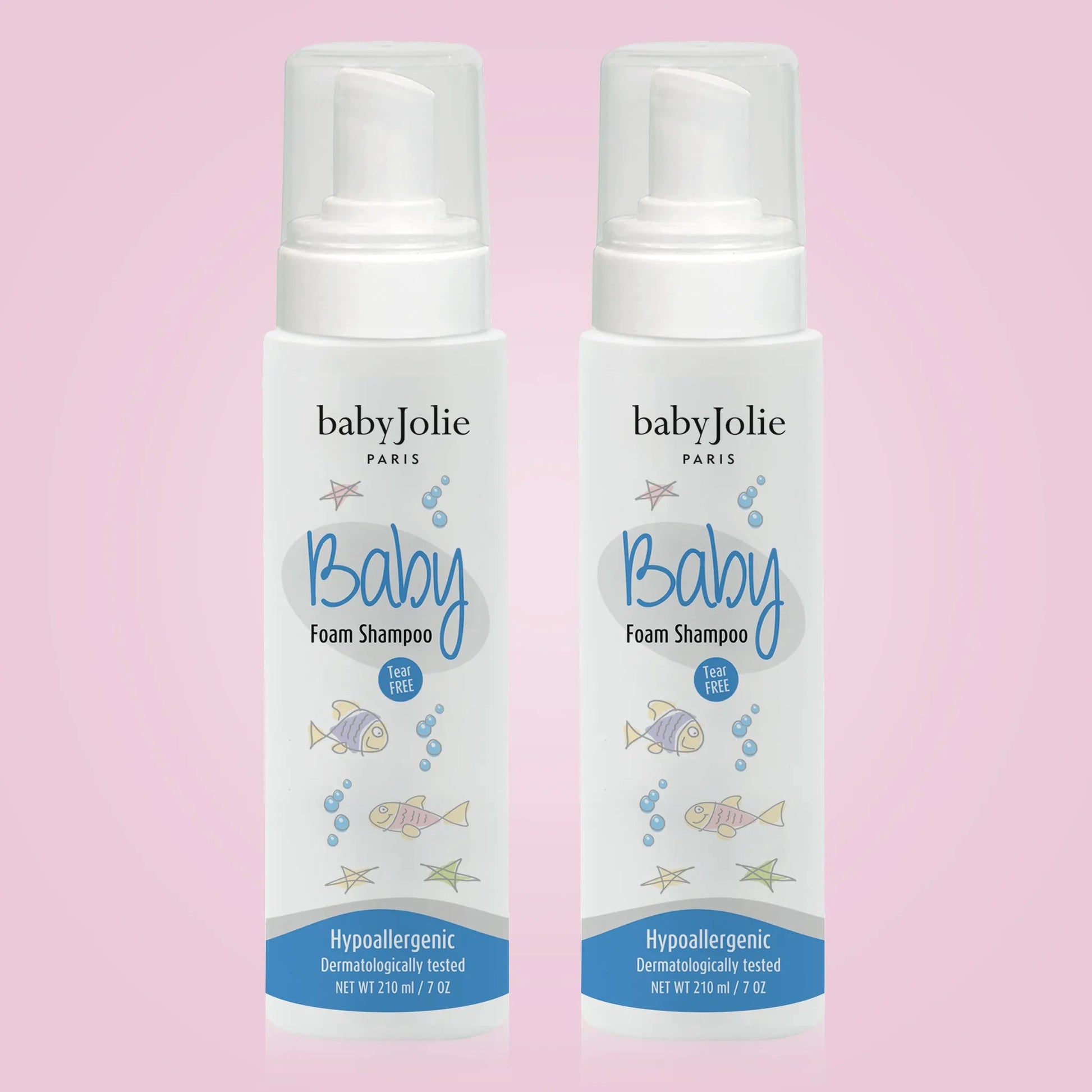 Two 7oz white bottles of Baby Jolie tear-free foam shampoo with clear caps and playful fish illustrations on a pink background.