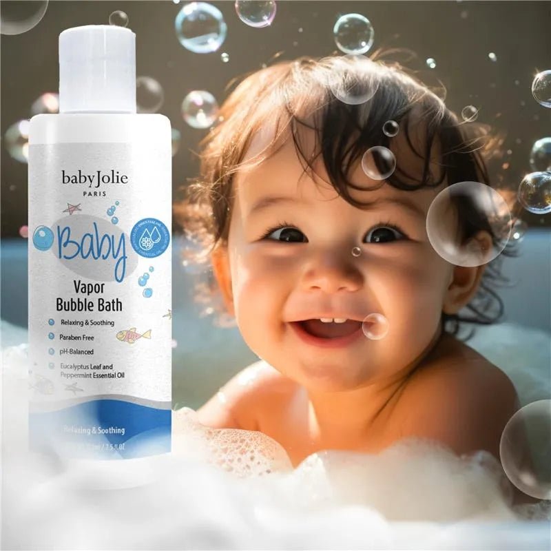 7.5 oz bottle of Baby Jolie Vapor Bubble Bath next to a happy baby playing in soapy bath bubbles.